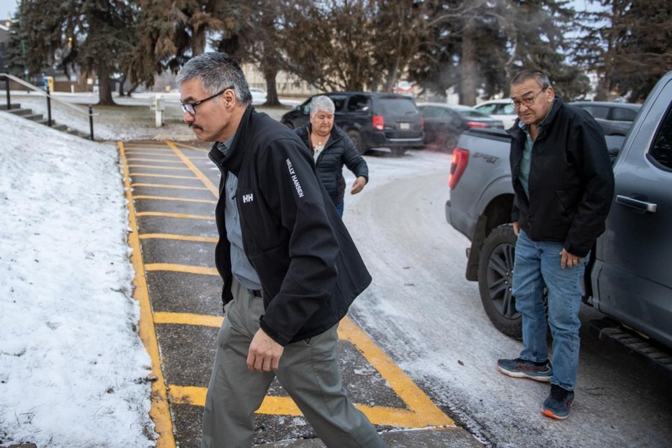 Former RCMP officer Bernie Herman, left, enters the Court of King’s Bench on the second day of his trial in Prince Albert, Sask., on Tuesday, Dec. 5, 2023.
