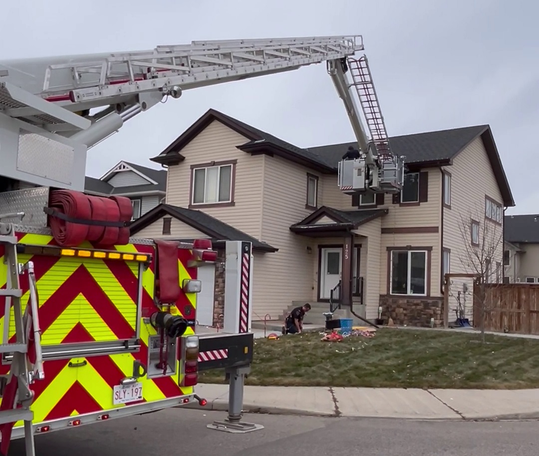 Chestermere firefighters set up lights on Satvir Sahota's house after he fell trying to set them up.