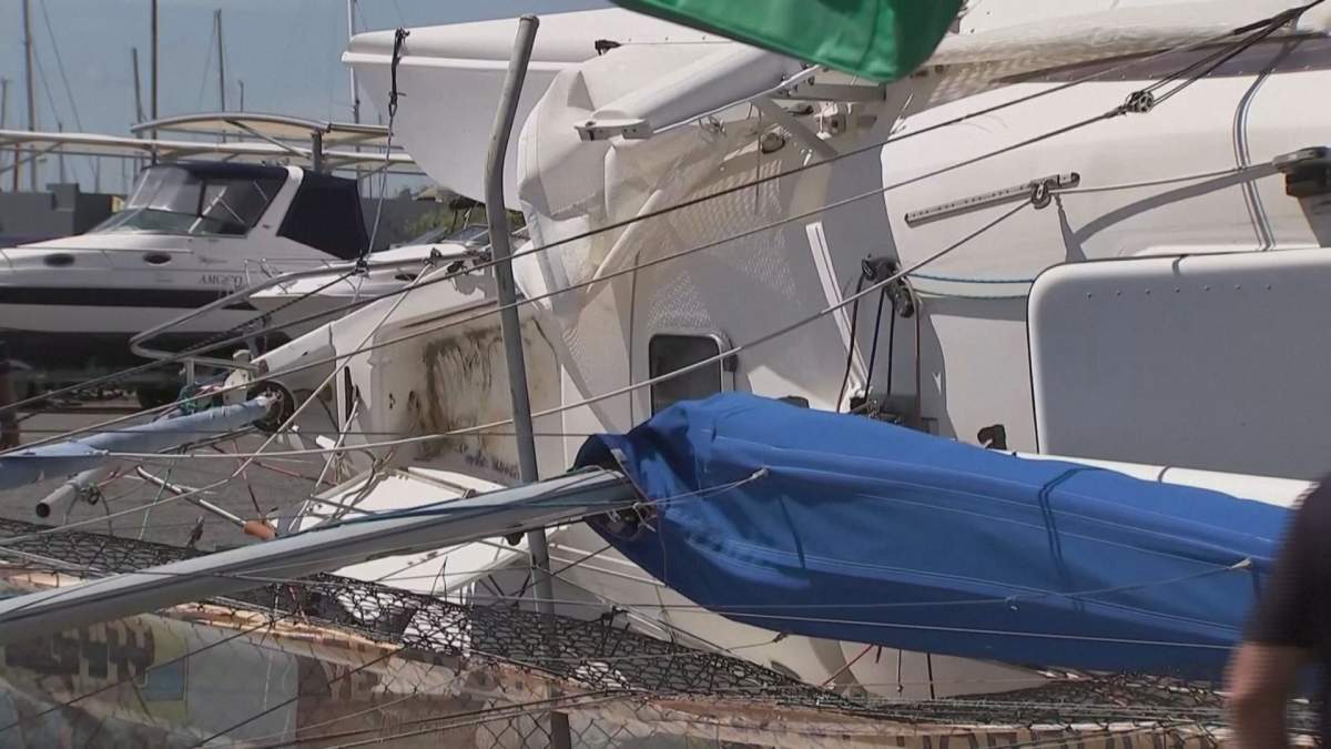 A damaged boat sits in the Brisbane harbour on Dec. 27, 2023, after wild weather tore through Queensland and Victoria states in Australia.