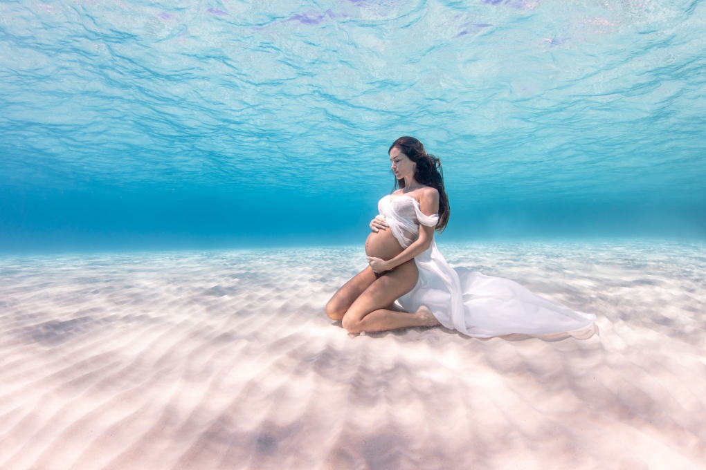 Kim Bruneau is photographed by Pia Oyarzun in a record-breaking deep sea photoshoot in Nassau, Bahamas.