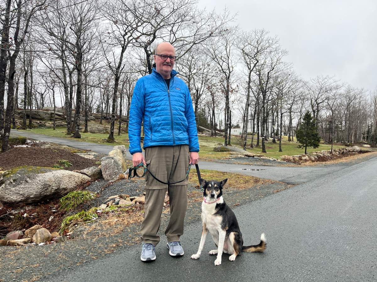 Hugh Chisholm with his dog Suzy.