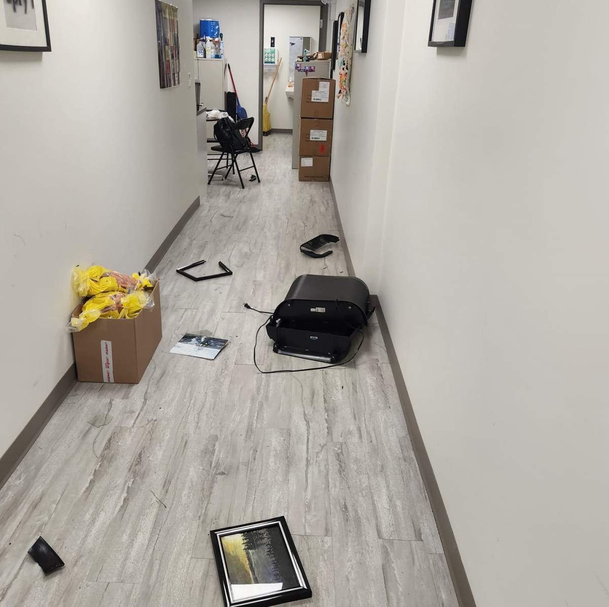 As shown in a Facebook post from Maguire, a picture frame appears to be knocked onto the floor alongside several other office items.