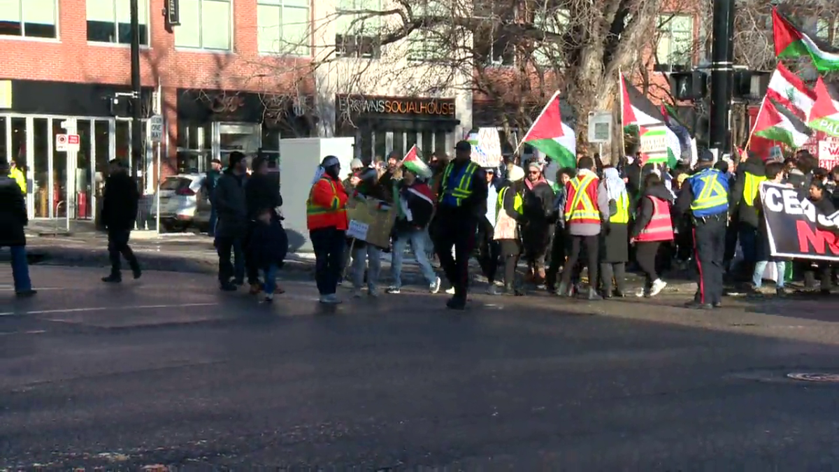Hundreds of pro-Palestine protestors marched down 17th Avenue S.W. on Sunday, despite Calgary police officers advising them not to.
