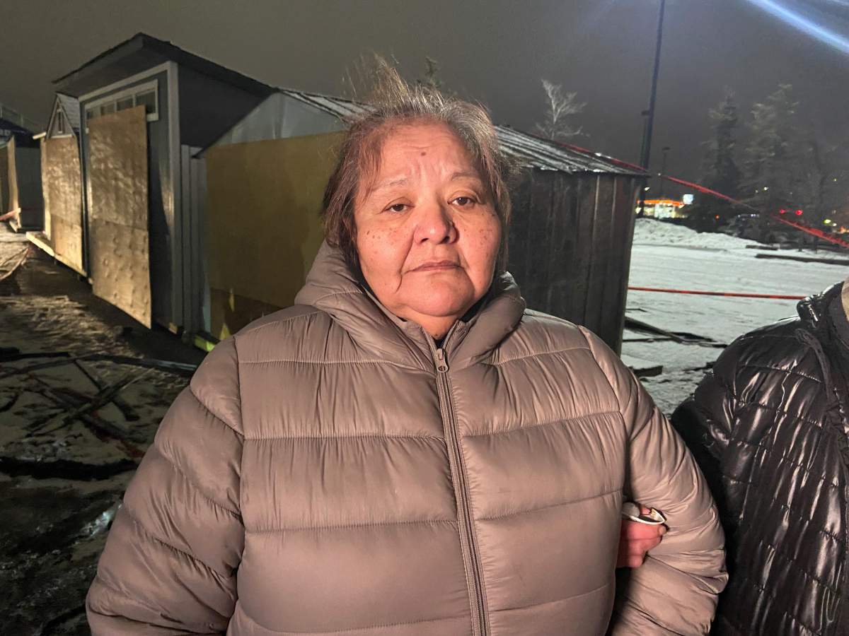 Wanda Hunter, the mother of shed fire victim Trent Rider, at the Dec. 14 candlelight vigil for the three people killed in the Dec. 11 fire outside the Lowe’s story in northwest Calgary.