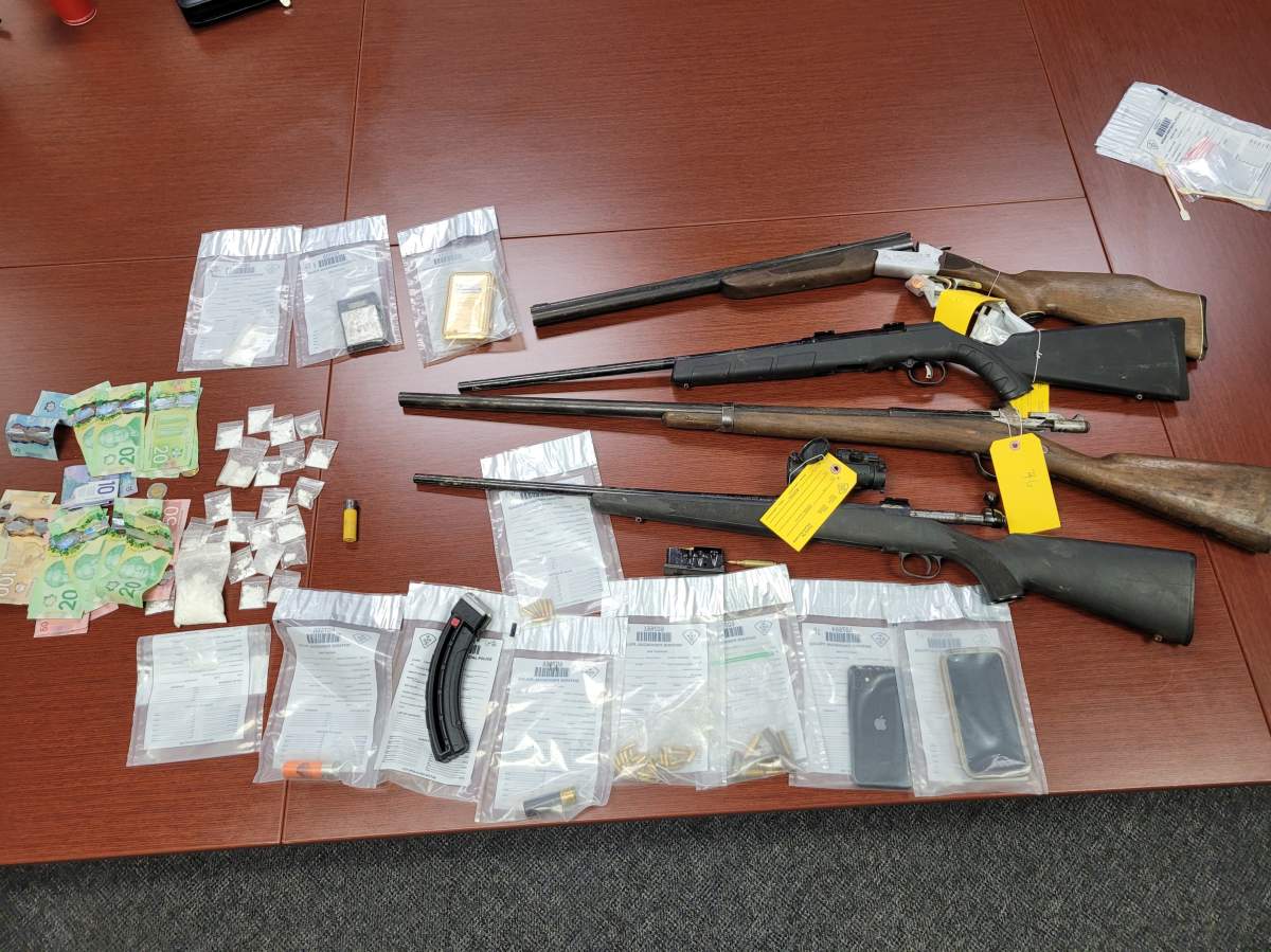 Two people have been charged after drugs, guns and stolen recreational vehicles were found in a police raid at a home in Consecon Thursday.