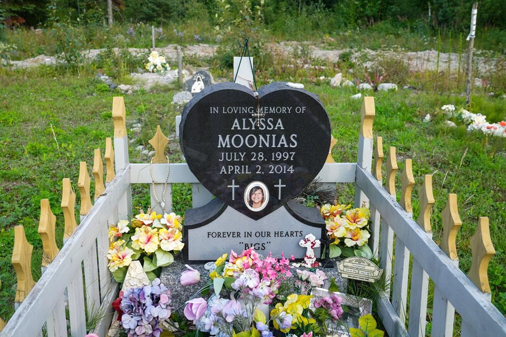 The gravesite of Alyssa Moonias is shown in the cemetery in Neskantaga First Nation on Saturday, Aug. 19, 2023. The teen took her own life in 2014, among a spate of suicides. Ten years ago, Neskantaga First Nation – a remote community with a population of about 450 – declared a state of emergency after four suicides and several attempted suicides by teens. The state of emergency officially remains, but the community quietly spoke about a small milestone this past summer: no one had killed themselves in Neskantaga in three years. THE CANADIAN PRESS/Chris Young.