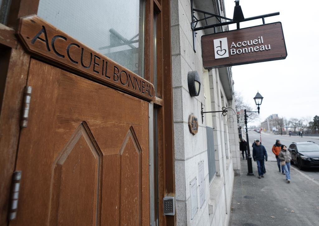 An Old Montreal organization serving people without homes says it will be able to continue offering hot meals seven days a week until the end of March after receiving emergency government aid. The Accueil Bonneau shelter is seen Tuesday, Jan. 2, 2024, in Montreal. 