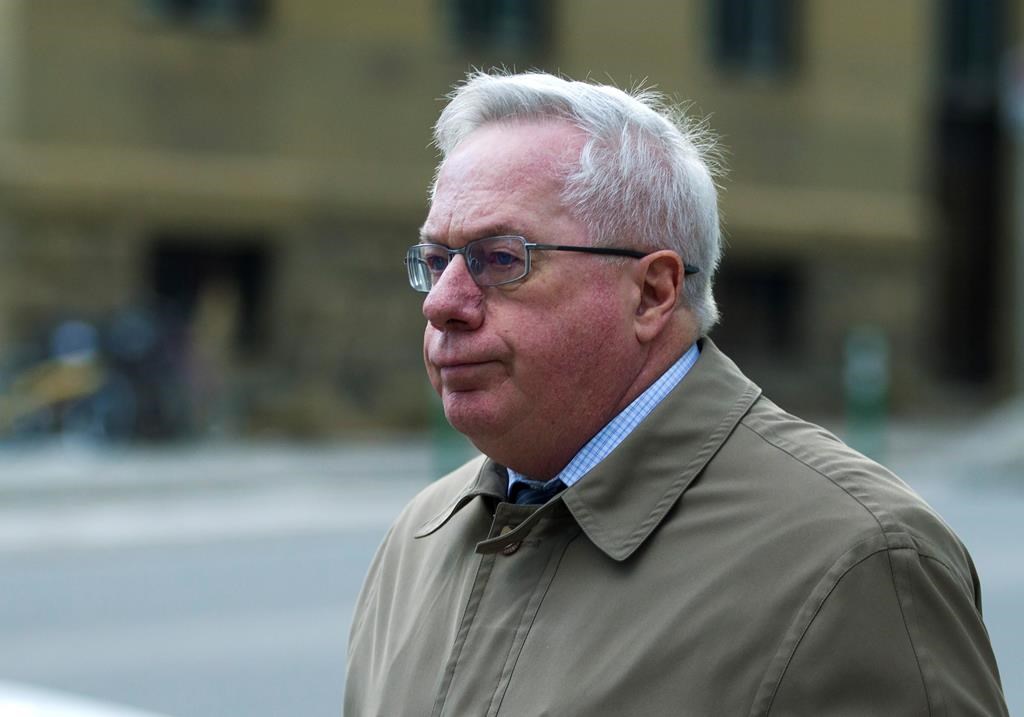Retired neurologist Keith Hoyte leaves the courthouse in Calgary, Monday, Jan. 6, 2020. Hoyte has been sentenced to three years in prison for sexually assaulting dozens of patients over a three decade period.