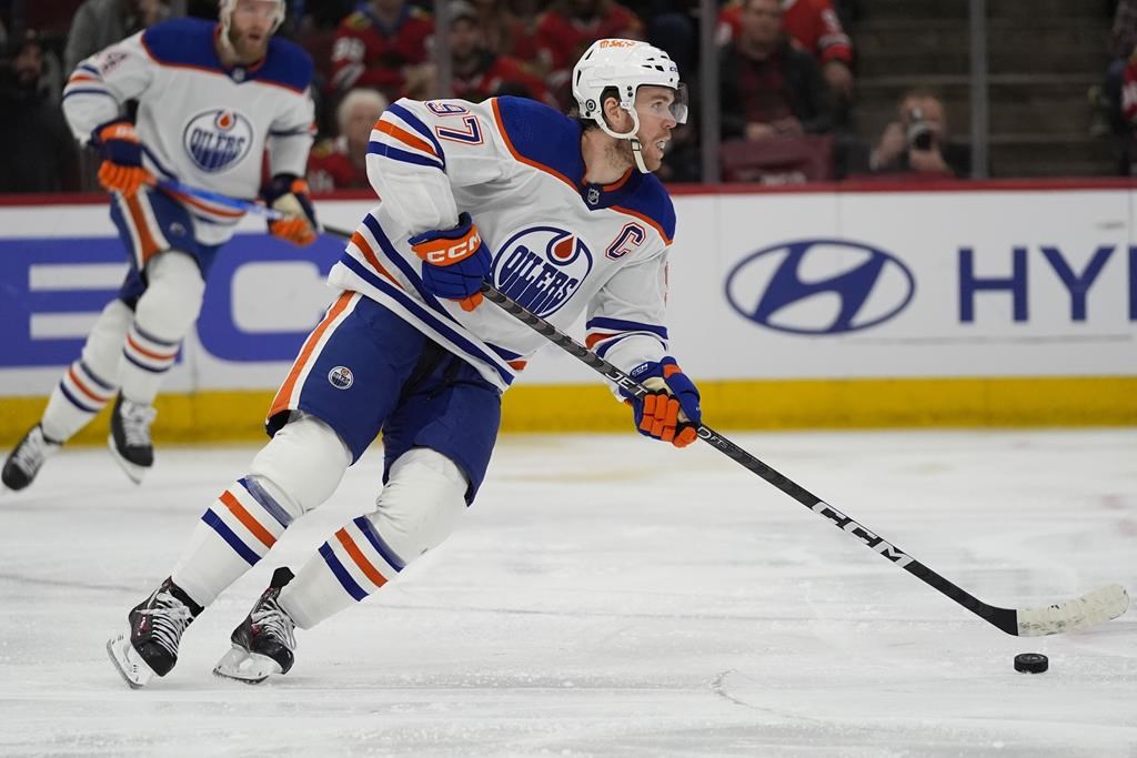 Edmonton Oilers center Connor McDavid handles the puck during the second period of the team’s NHL hockey game against the Chicago Blackhawks on Tuesday, Jan. 9, 2024, in Chicago.
