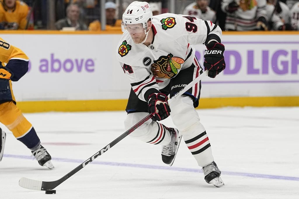 FILE - Chicago Blackhawks right wing Corey Perry (94) plays during the first period of an NHL hockey game against the Nashville Predators, Nov. 18, 2023, in Nashville, Tenn.
