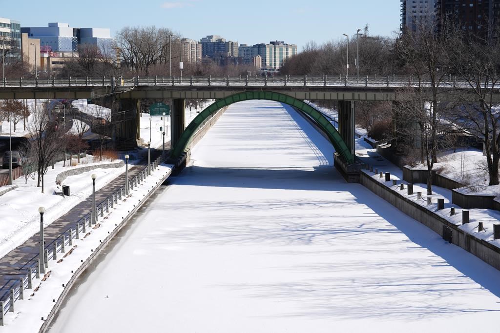 An unopened Rideau Canal is pictured in Ottawa on Friday, Feb. 24, 2023. Ottawa is looking at another weekend without skating on the Rideau Canal, even with below-normal winter temperatures on the horizon for the weekend. 