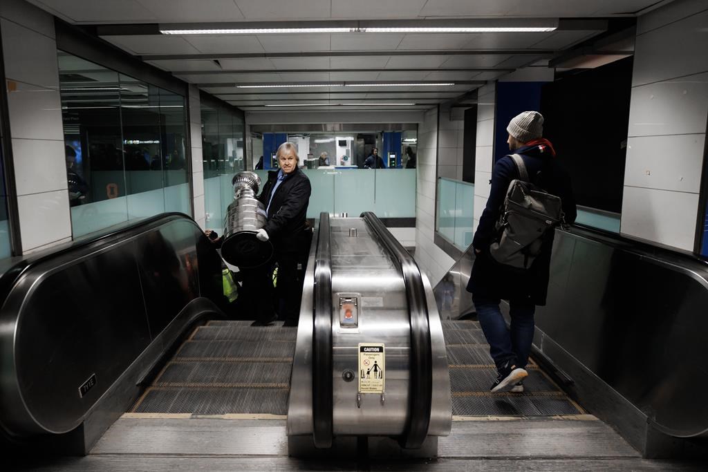 Phil Pritchard, keeper of the Cup, carries the Stanley Cup to a photo op at Union Station in Toronto, Monday, Jan. 22, 2024. The NHL championship trophy took the subway from midtown Toronto to the city’s downtown core this morning to promote the upcoming NHL All-Star Game.