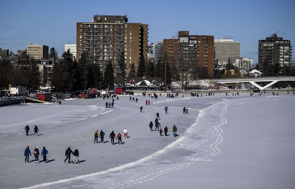 <div>Heavy snow blanketed some of the views, and the ice was in rough shape, but that didn't stop skaters from gliding down the partially-opened Rideau Canal Skateway today. People skate on the Rideau Canal Skateway on its opening day in Ottawa, on Sunday, Jan. 21, 2024. THE CANADIAN PRESS/Justin Tang</div>.