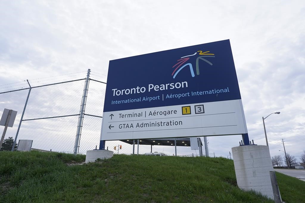 A sign for Toronto Pearson International Airport is pictured in Mississauga, Ont., on Thursday, April 20, 2023. 