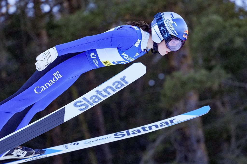 Canada's Alexandria Loutitt competes at the Women Normal Hill Individual Ski Jumping World Cup event in Villach, Austria, Thursday, Jan. 4, 2024.&nbsp;Loutitt captured World Cup bronze in women's ski jumping on Saturday for her sixth podium of the season. THE CANADIAN PRESS/AP-Darko Bandic