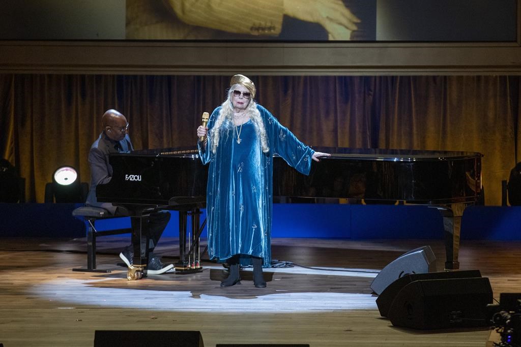 Joni Mitchell performs at the presentation of the Gershwin Prize, which honours a musician's lifetime contribution to popular music, hosted at DAR Constitution Hall in Washington on Wednesday, March 1, 2023. Mitchell's music is back on Spotify, more than two years after the songwriter pulled it down to protest the streaming service.