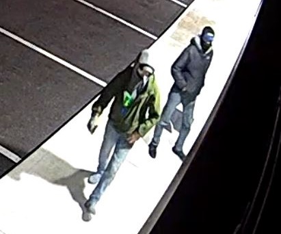 Two suspects wanted in connection to a break in at a Kingston business are seen in a police photo.