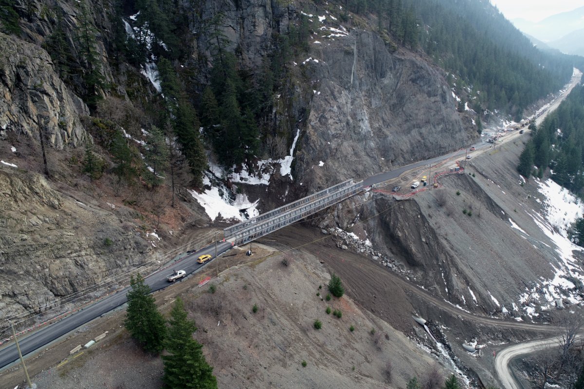 File photo of work crews installing a temporary bridge at the Jackass Mountain washout along the Trans-Canada Highway in B.C.’s Fraser Canyon in December 2021.