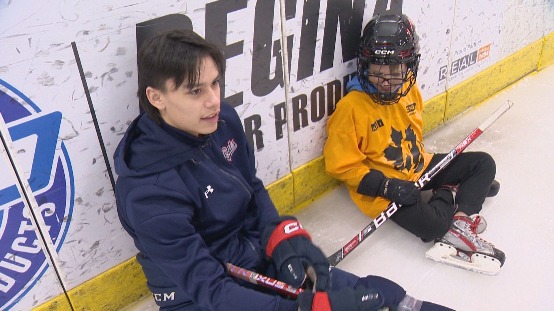 Regina Pats help teach blind kids the sport of hockey