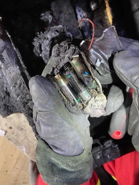 The batteries of a toy that sparked a fire in the basement of a home on the 300 block of Anderson Crescent.