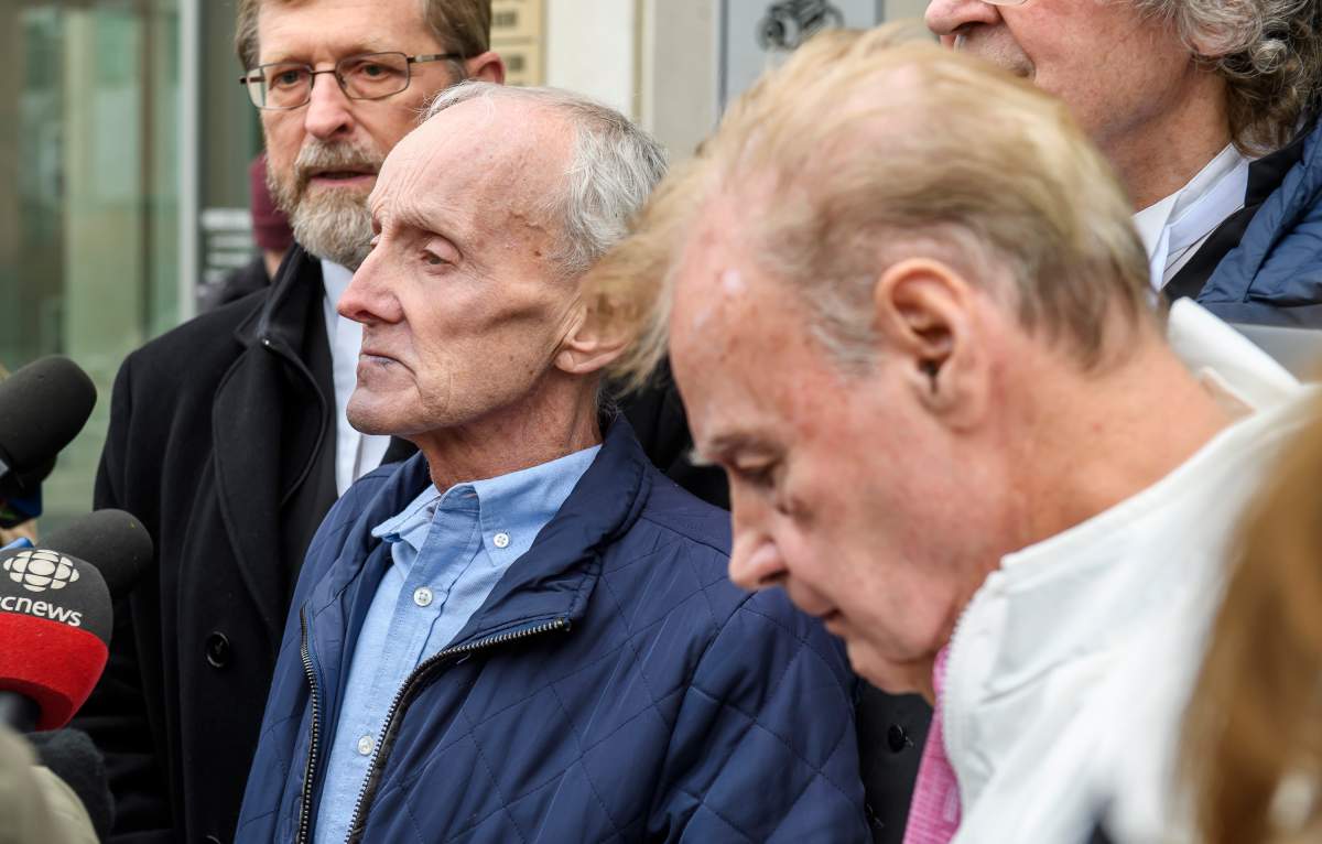 Robert Mailman, left, and Walter Gillespie, speak to media shortly after their hearing at Saint John Law Courts in Saint John, N.B., January 4, 2024. The two men recently had a 1984 murder conviction overturned and have now been found formally not guilty. THE CANADIAN PRESS/Michael Hawkins