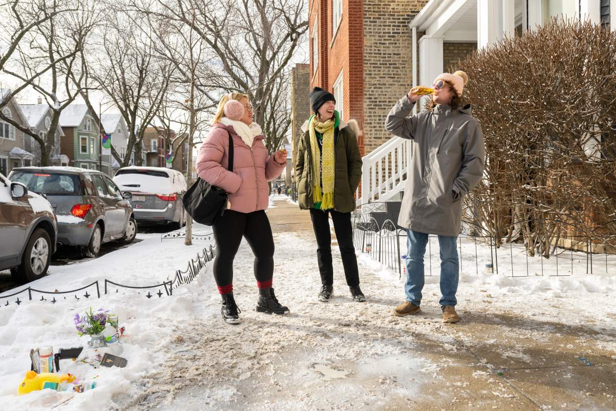 From left, Olivia Grover, Mo Flanagan, and Perry Sadler take a drink of Malört next to Chicago’s iconic Rat Hole in the 1900 block of West Roscoe Street in the Roscoe Village neighbourhood, Friday, Jan. 19, 2024 in Chicago.