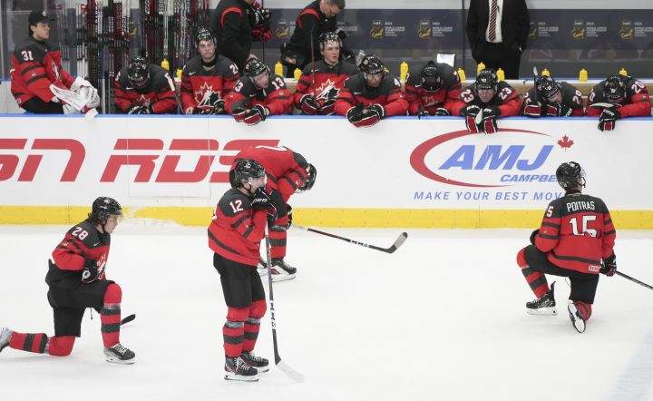 Canada players (left to right) Conor Geekie, Fraser Minten and Matthew Poitras react following their loss to Czechia during quarter-final hockey action at the IIHF World Junior Hockey Championship in Gothenburg, Sweden, Tuesday, Jan. 2, 2024.