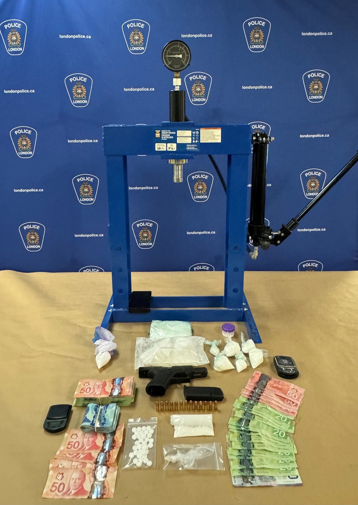 A firearm, ammunition, suspected cocaine, a hydraulic press and cash were among the items seized by London police officers following search warrants executed at three residences on Friday Jan. 5, 2024.