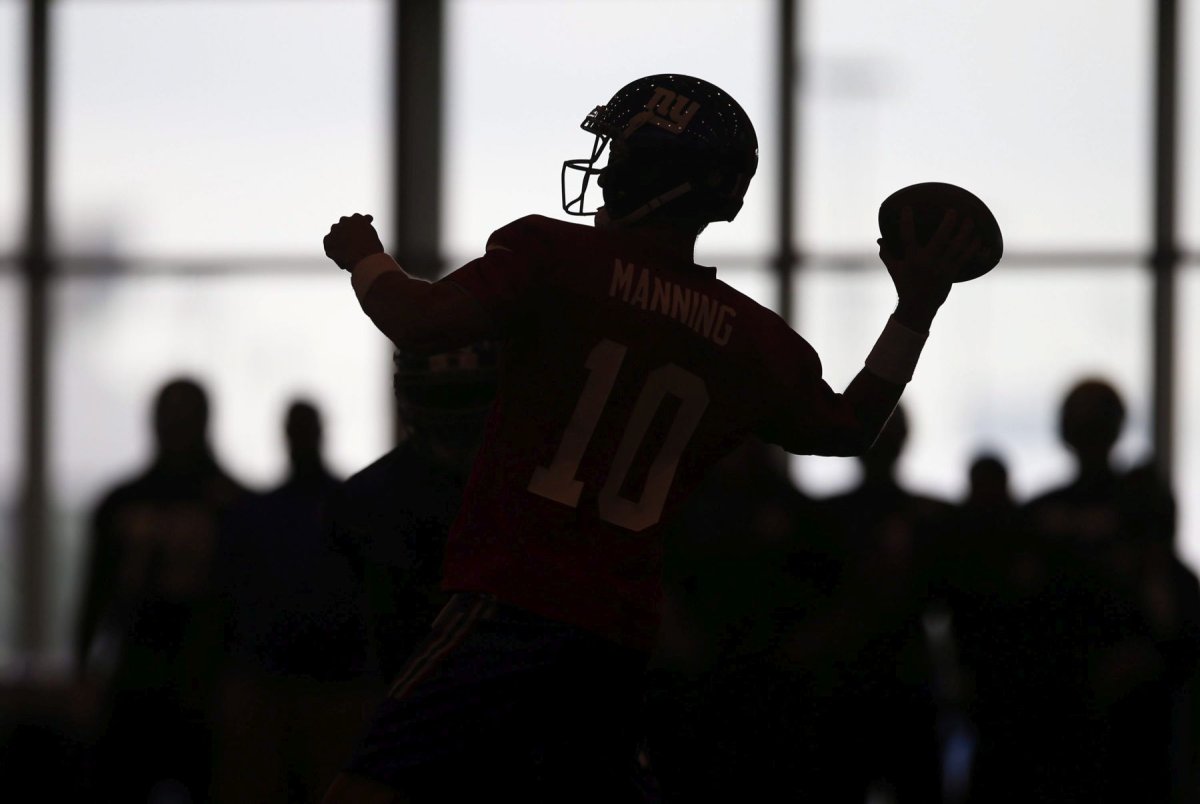A football player is silhouetted as he throws a pass in East Rutherford, N.J. on Sunday, July 31, 2016. Canada will defend its world junior football championship when the event resumes this summer following a six-year hiatus.