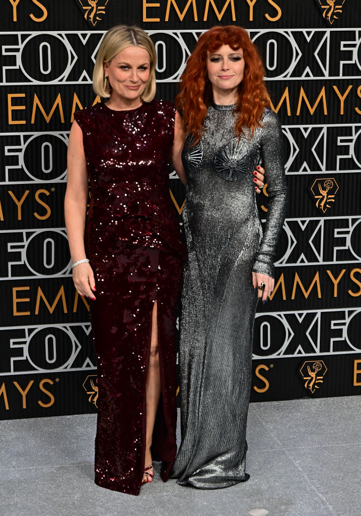 Natasha Lyonne (R) and Amy Poehler arrive for the 75th Emmy Awards at the Peacock Theatre at L.A. Live in Los Angeles on January 15, 2024.