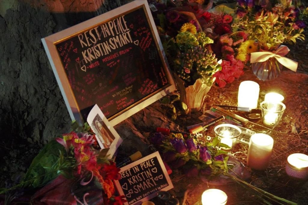 Cal Poly students laid out flowers, lit candles, burned essence and wrote well-wishing notes on a chalkboard to Kristin Smart and her family during a candlelight vigil on April 13, 2021.