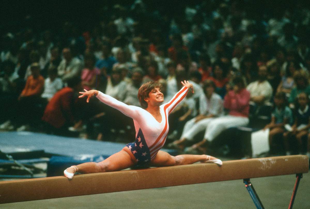 Mary Lou Retton in the splits on the balance beam.