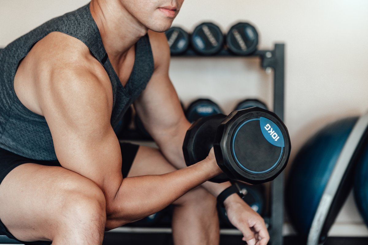 man lifting weights at the gym
