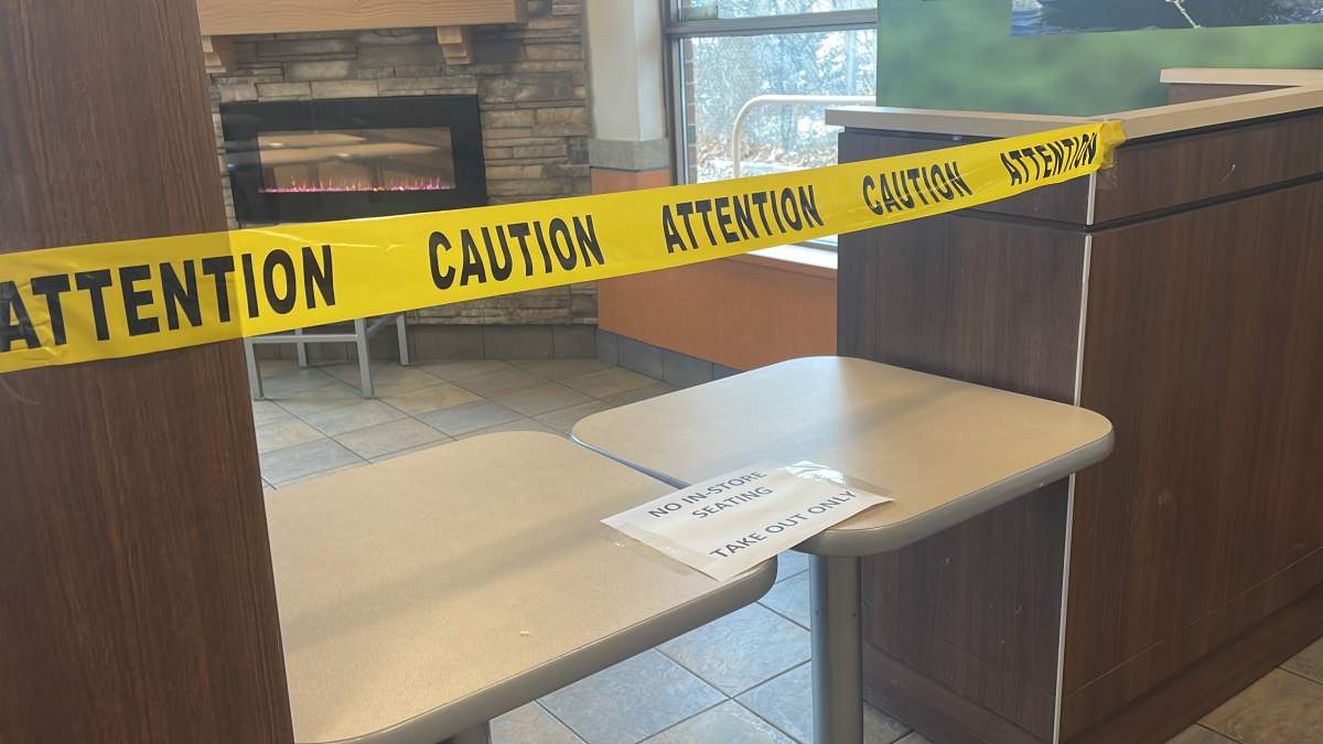 Tape blocking off the 415 Simcoe St. South Tim Hortons dining area.