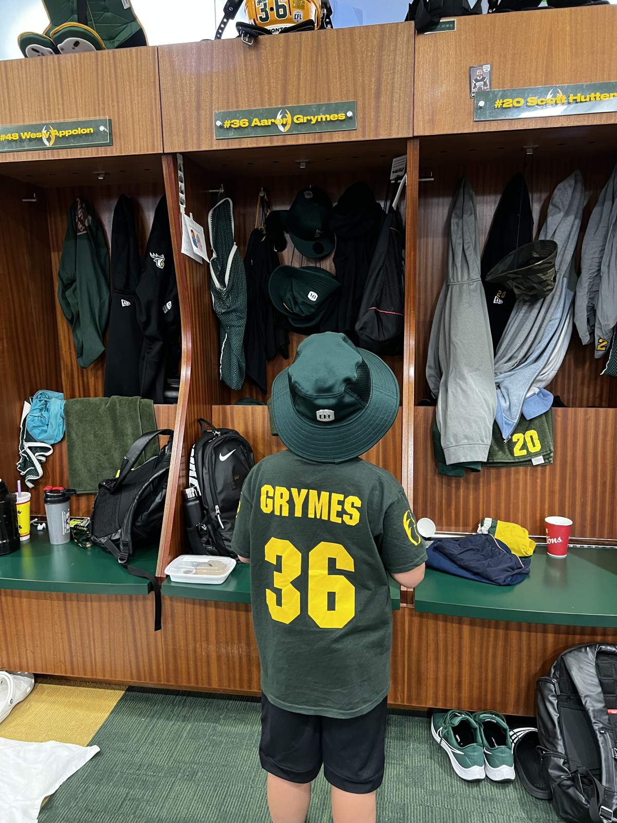 Jace Nerbas looking up at a Aaron Grymes locker