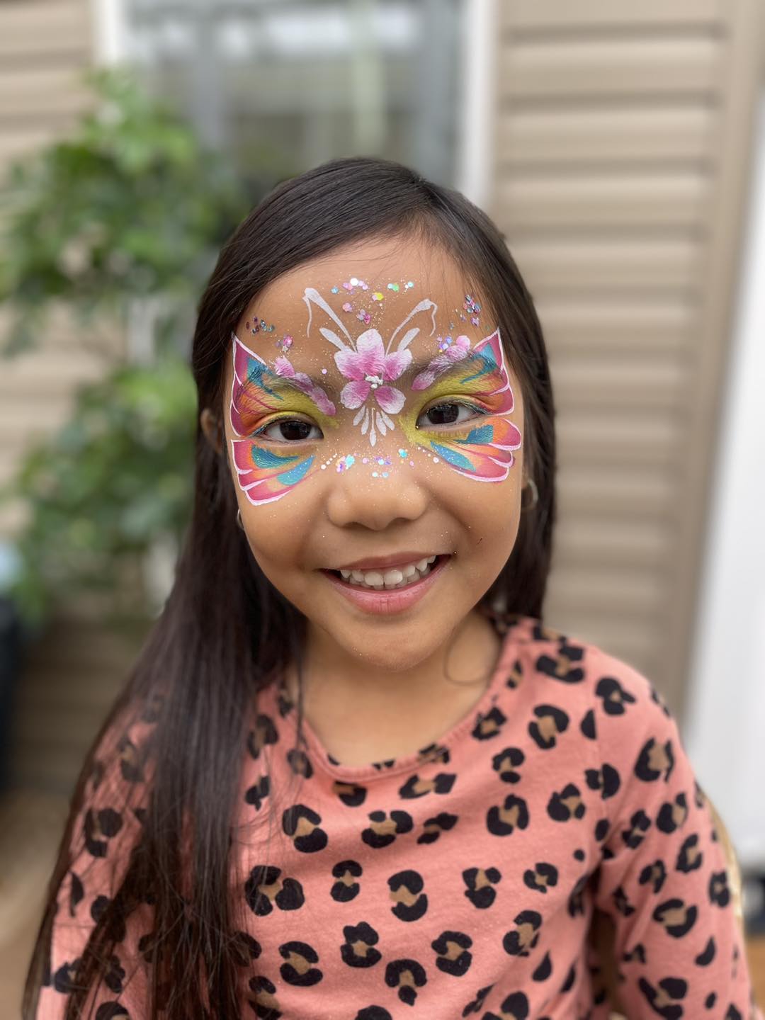 Photo showing Julia's Jubilant Face Painting.