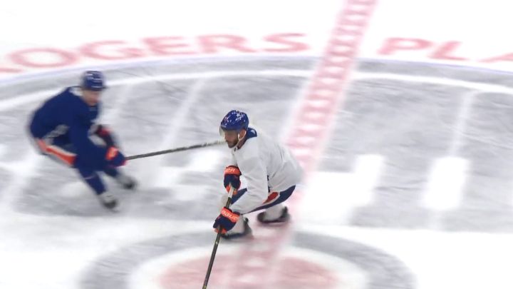 Evander Kane skates with the puck at an Oilers practice in Edmonton on Jan. 22, 2024.