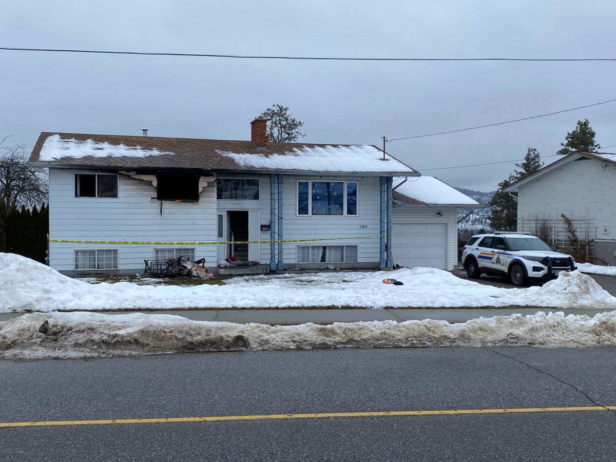 Police tape surrounds a home along Dougall Road following an upstairs fire on Wednesday morning.