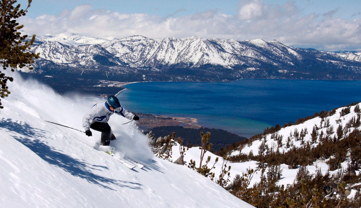 File photo of a skier kicking up some powder at Heavenly Ski Resort in South Lake Tahoe, Calif., in 2010. A snowboarder spent 15 hours trapped overnight Thursday, Jan. 26, 2024, inside a ski lift gondola amid freezing temperatures at the Lake Tahoe resort.