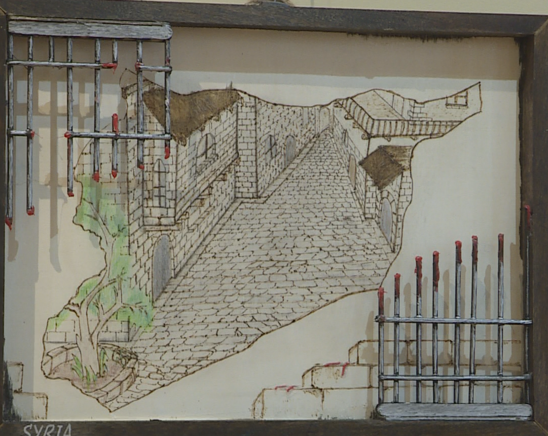 A picture of a stone courtyard with what appears to be bloodied fences along the frame.