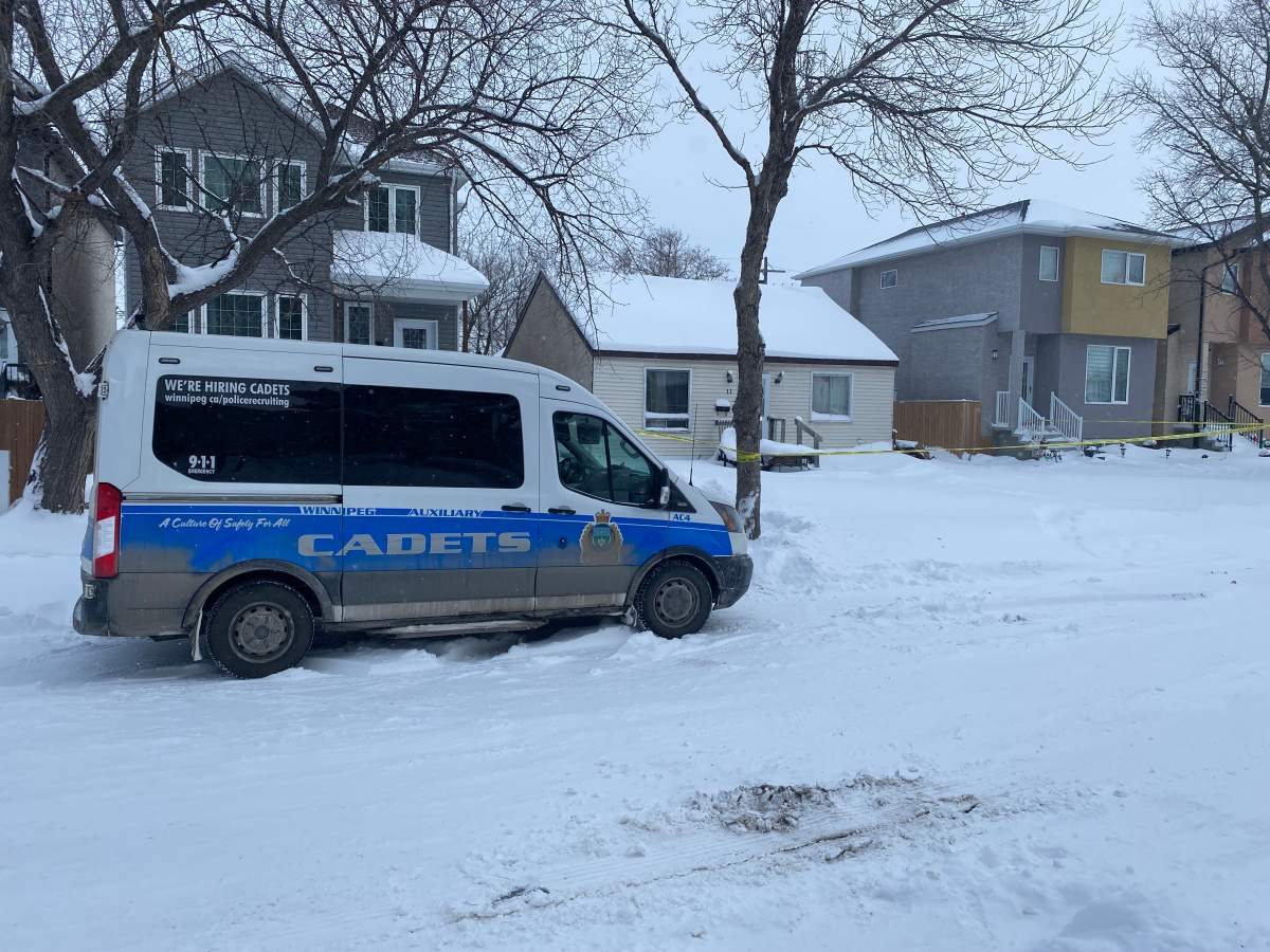 A Winnipeg police cadets vehicle is seen outside the home where the incident took place.