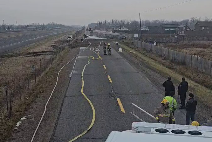 Emergency crews on seen on a portion of South Service Road in Beamsville, Ont. after a Fuel Tanker Truck crash near the QEW.