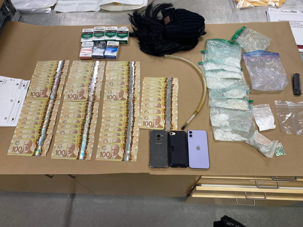 Items seized by Okotoks RCMP following arrests in relation to alleged 'grandparent scams.'