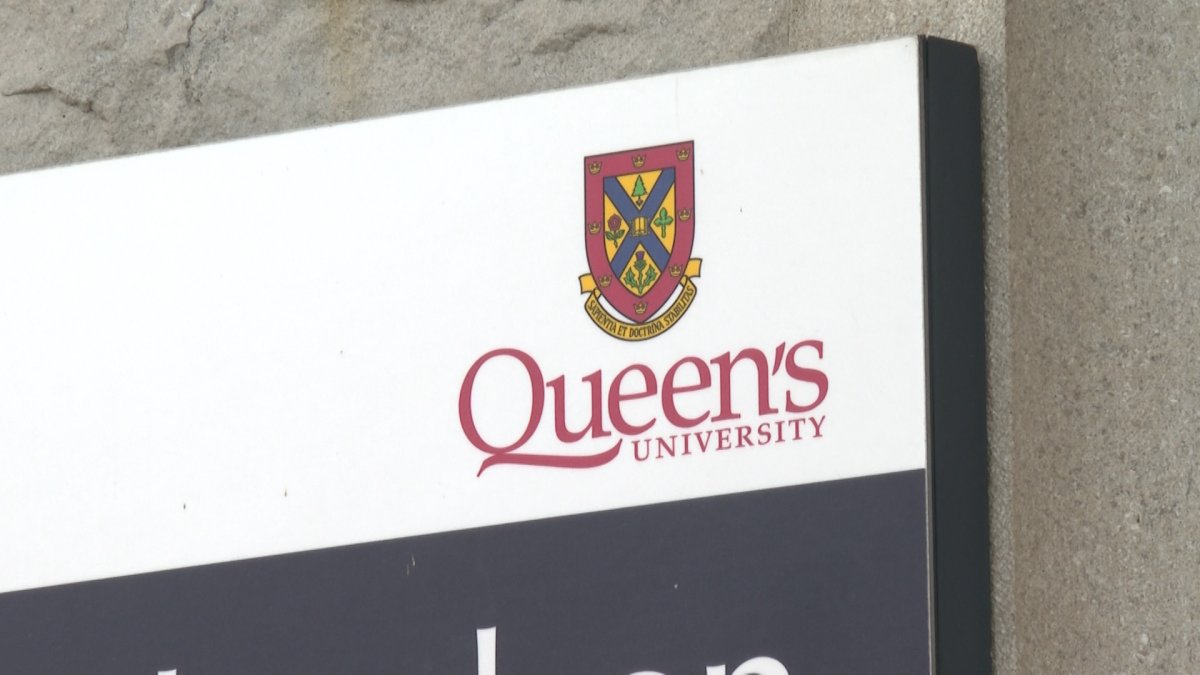 Queen's University crest on a sign on the university campus.
