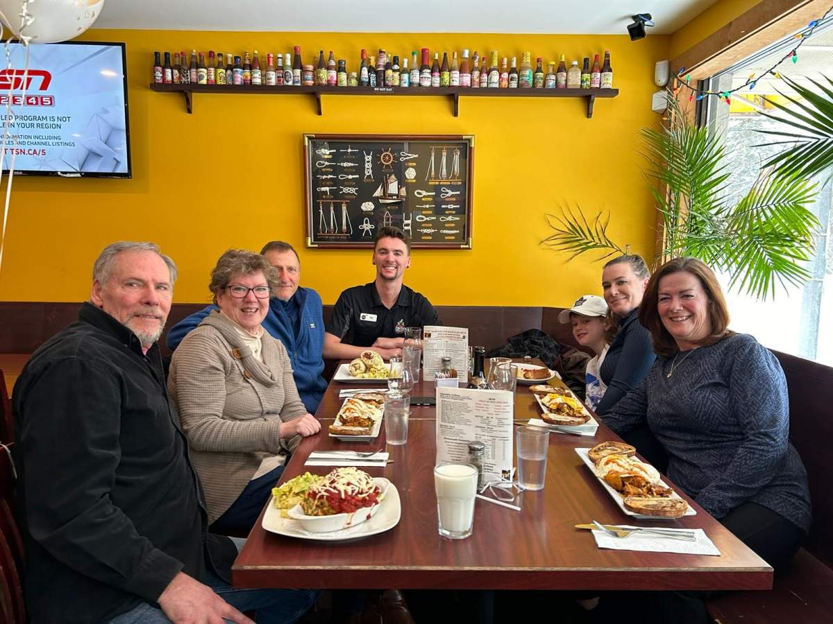 Chris Smith, 65, and Sue Vanvolkingburgh, 60, celebrating 20th anniversary of life-saving bone marrow transplant in Wasaga Beach, Ont., with close family.