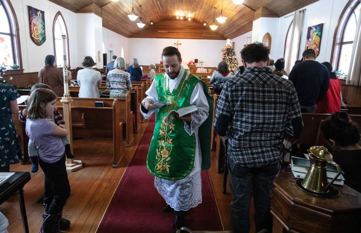 Father Aaron Solberg holds a Sunday service after 6 people were killed in a plane crash on Tuesday, in Fort Smith, N.W.T., Sunday, Jan. 28, 2024.