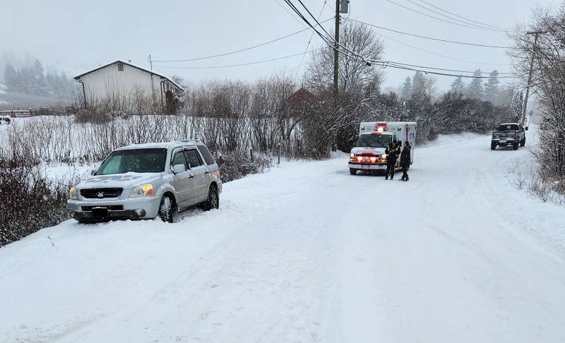 A police photo of the scene in Lake Country, B.C., showing the suspect truck and the SUV, along with an ambulance.