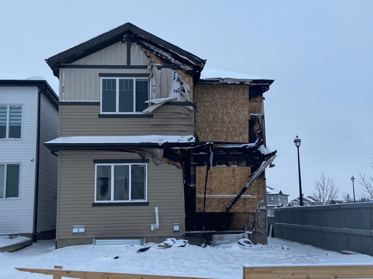 An Active Homes showhome that was the scene of a fire on Dec. 14, 2023 in Beaumont's Triomphe Estates neighbourhood seen boarded up on Tuesday, January 16, 2024.