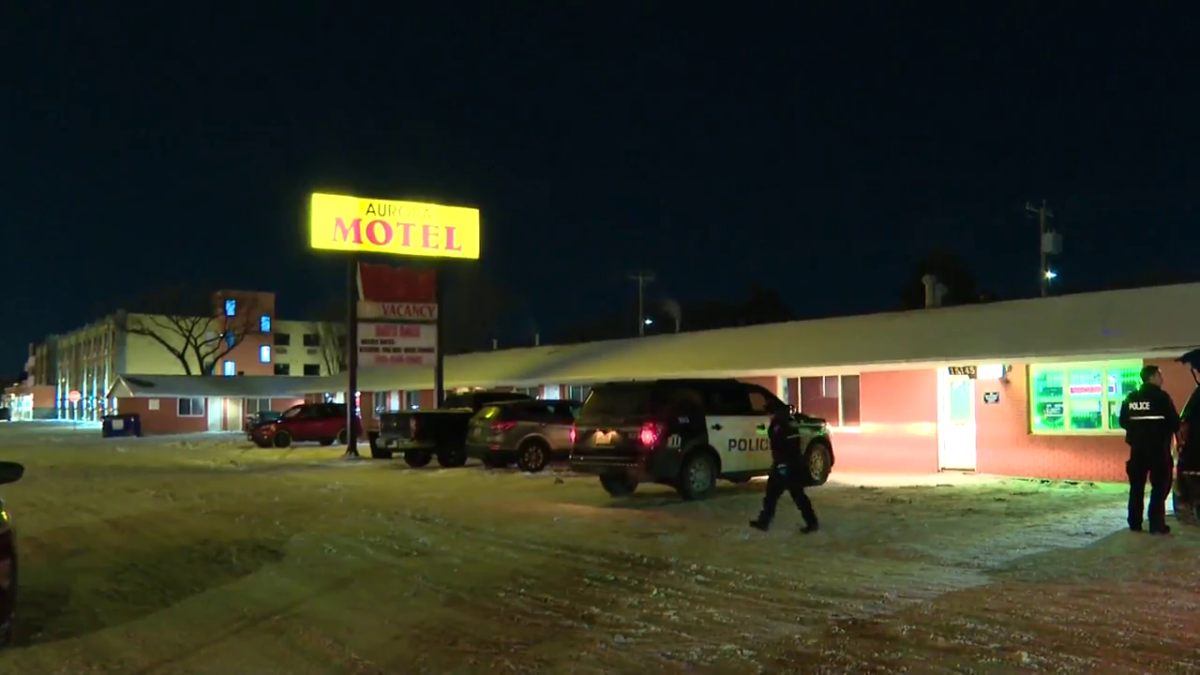 Edmonton police investigate a shooting at the Aurora Motel Friday night.