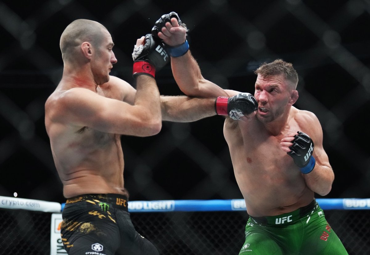 Sean Strickland, left, fights Dricus Du Plessis during a middleweight title bout at UFC 297 in Toronto on Sunday, Jan. 21, 2024.